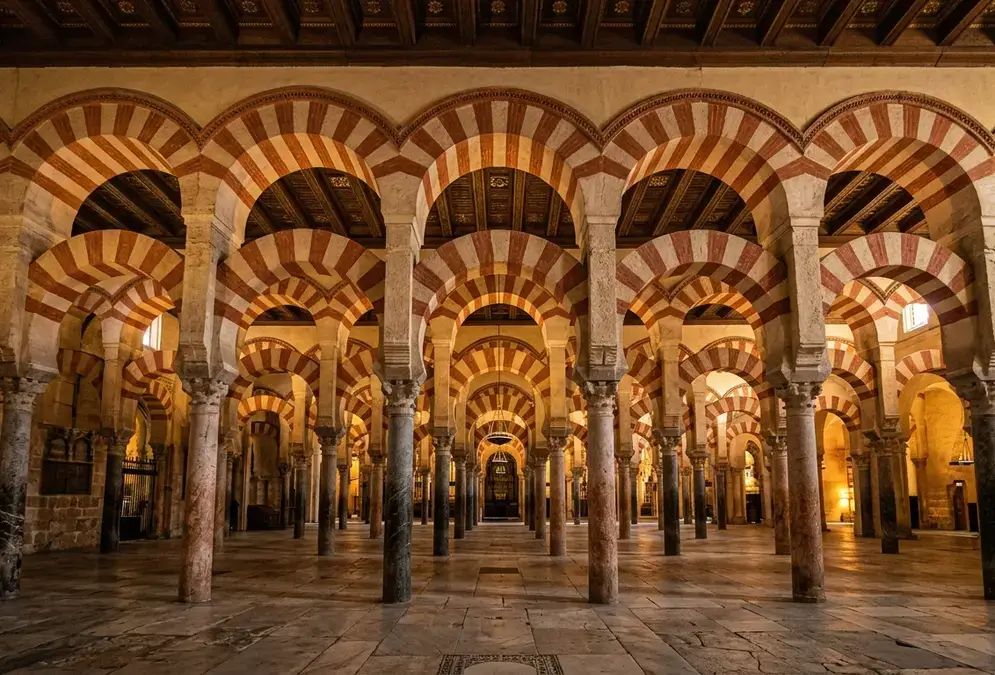 Double-tiered horseshoe arches receding through the Mezquita nave, Córdoba