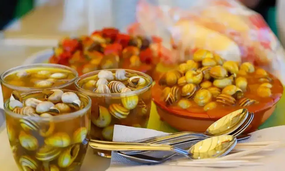 Glass of Córdoba caracoles — small snails in hot aromatic broth with cumin and mint