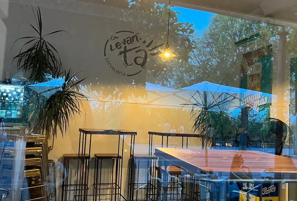 Craft beer taps and brewing tanks at Cervecería Califa