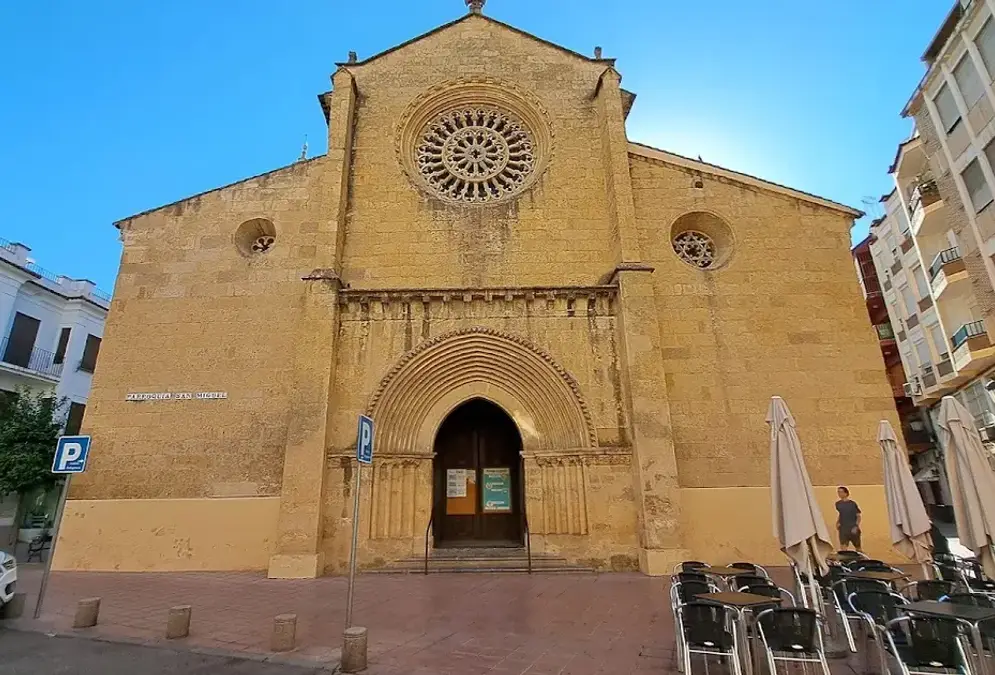 Iglesia de San Miguel with its Gothic rose window and orange-tree-shaded square