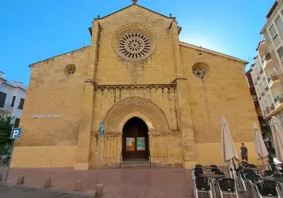 Iglesia de San Miguel with its Gothic rose window and orange-tree-shaded square