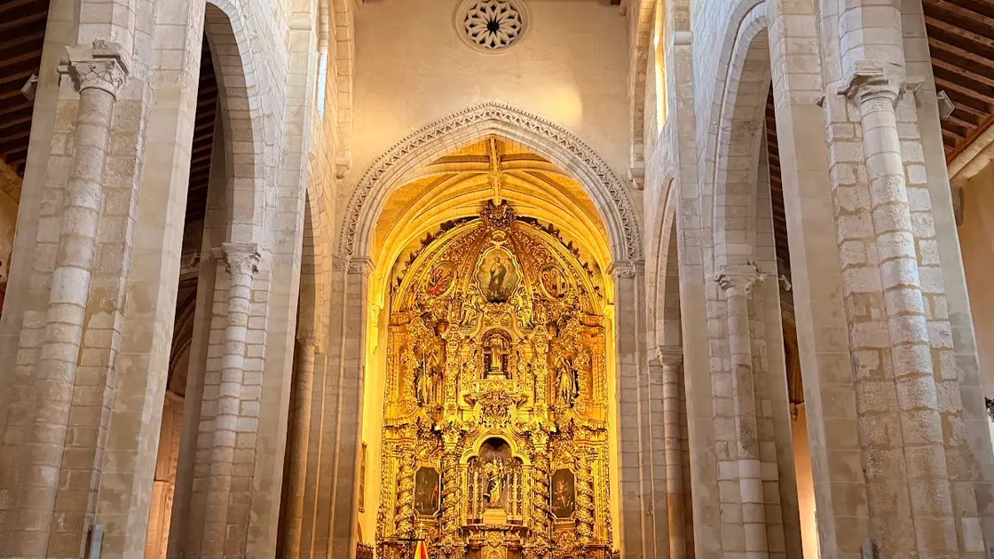 Gothic-Mudéjar façade and tower of the Basílica Menor de San Pedro on Plaza de San Pedro in Córdoba, in warm afternoon light