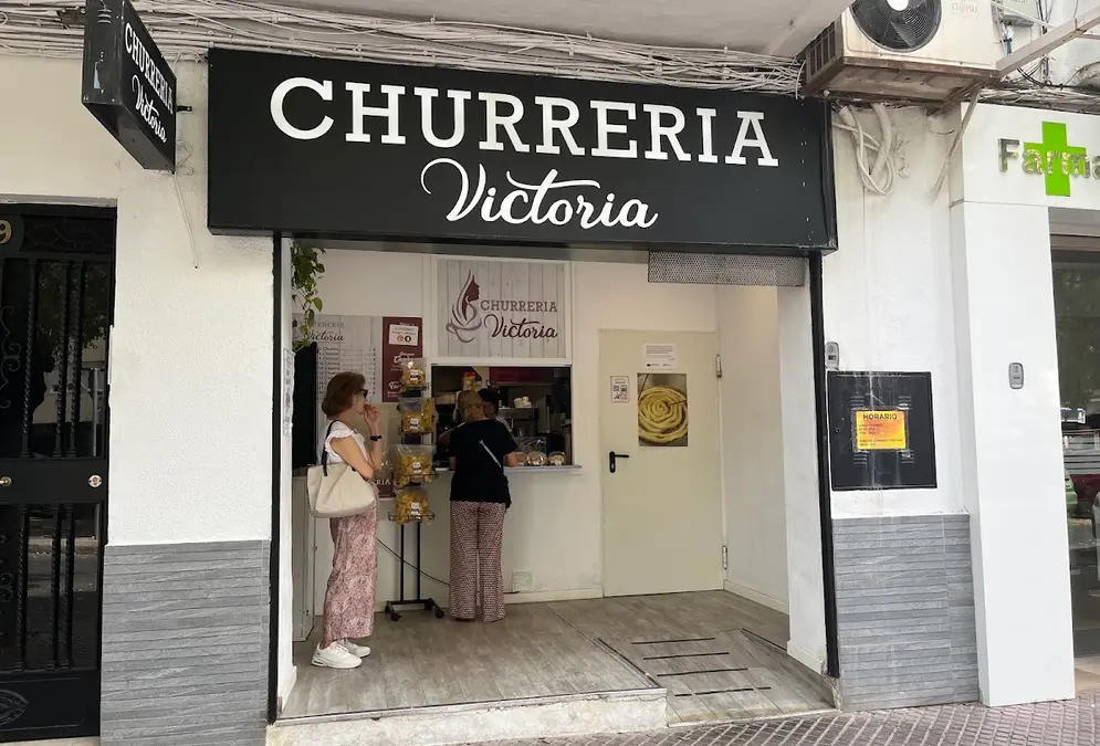 Jeringos with a cup of hot chocolate at Churrería Victoria on Avenida Doctor Fleming in Córdoba
