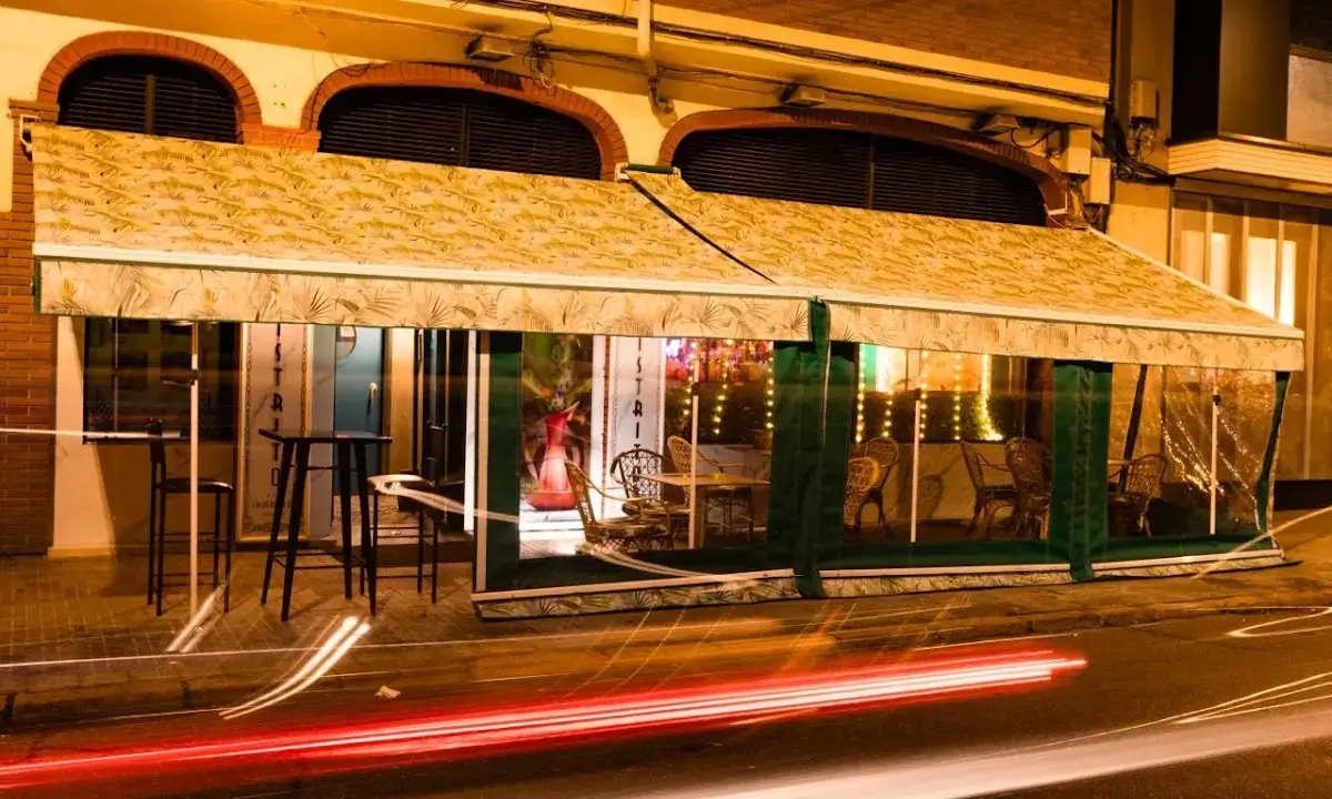 Cosy interior of Distrito Cocktail Bar with vintage décor and soft lighting