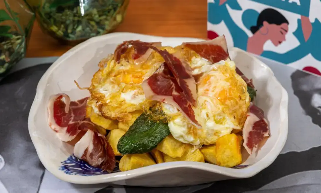Interior of the Doble de Cepa flamenco tavern with air-conditioned patio and traditional Andalusian décor