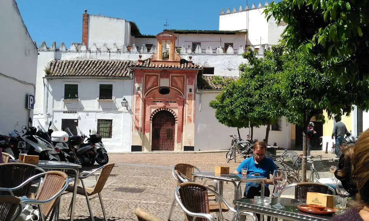 Terrace of Taberna El Barón on Plaza de Abades with orange trees in Córdoba