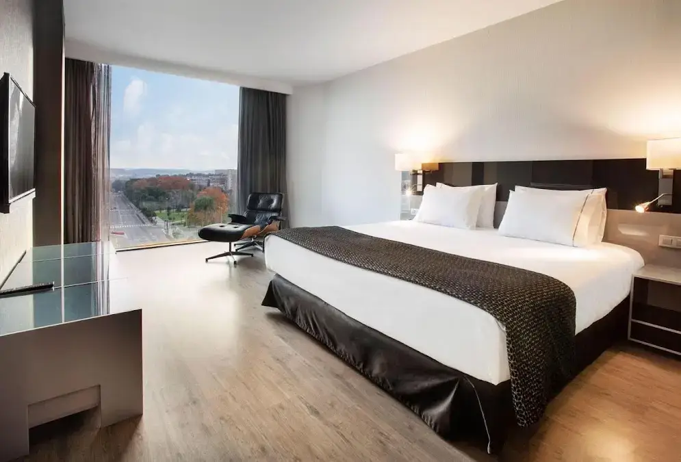 Contemporary white façade of Eurostars Palace with its six floors and rooftop pool