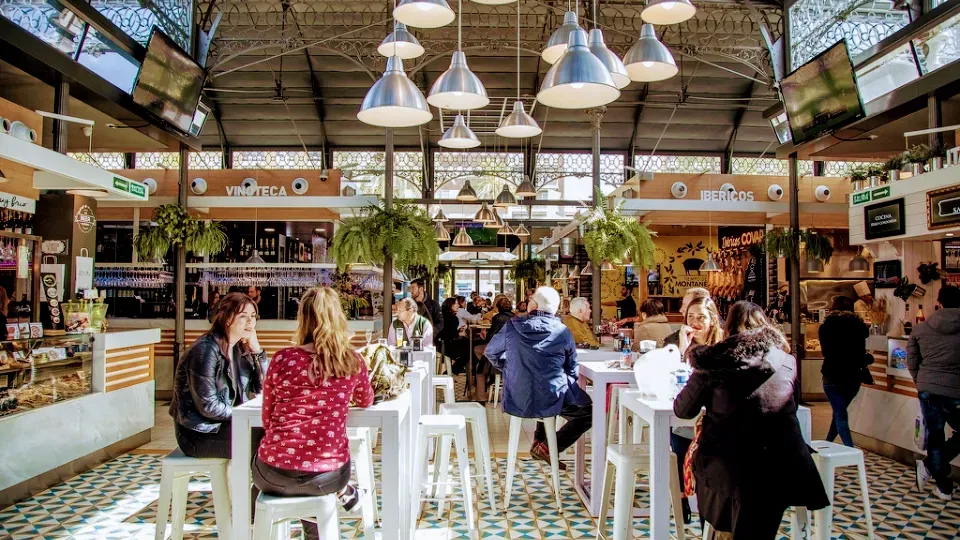 Stalls of olive oil, wine and Andalusian produce at the Mercado Victoria