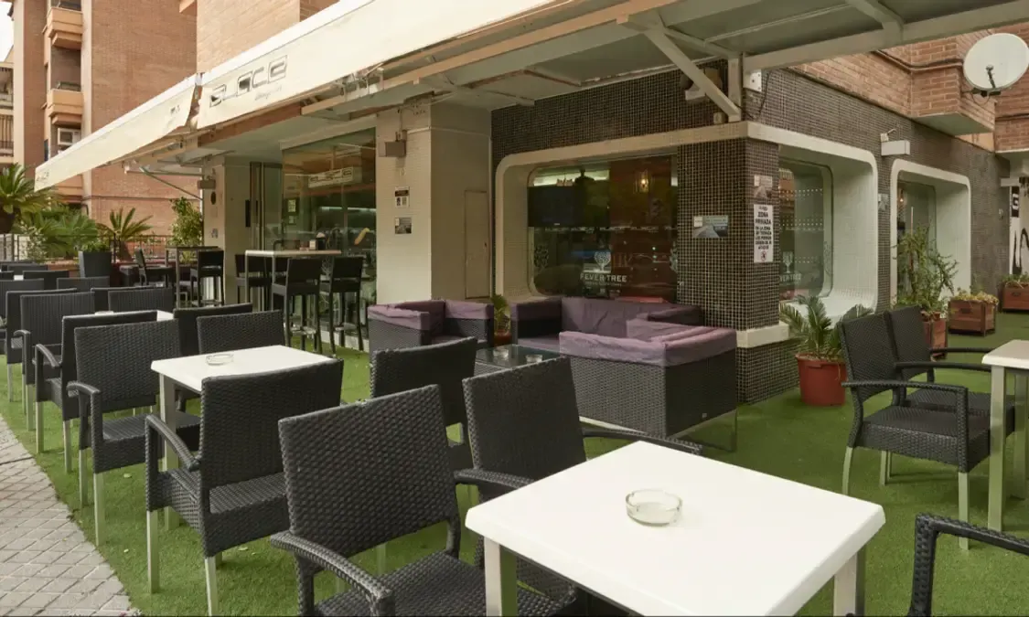 Elegant bar counter at Glace Lounge Bar with colorful cocktails