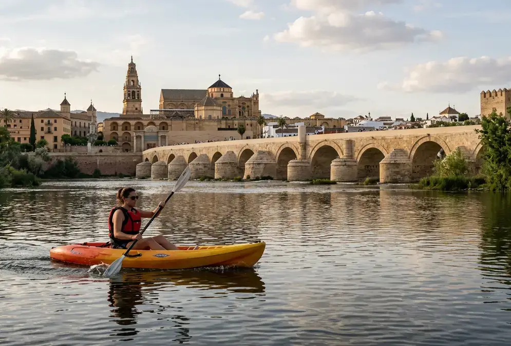 Kayak on the Guadalquivir river in Córdoba with the Roman Bridge and Mezquita in the background