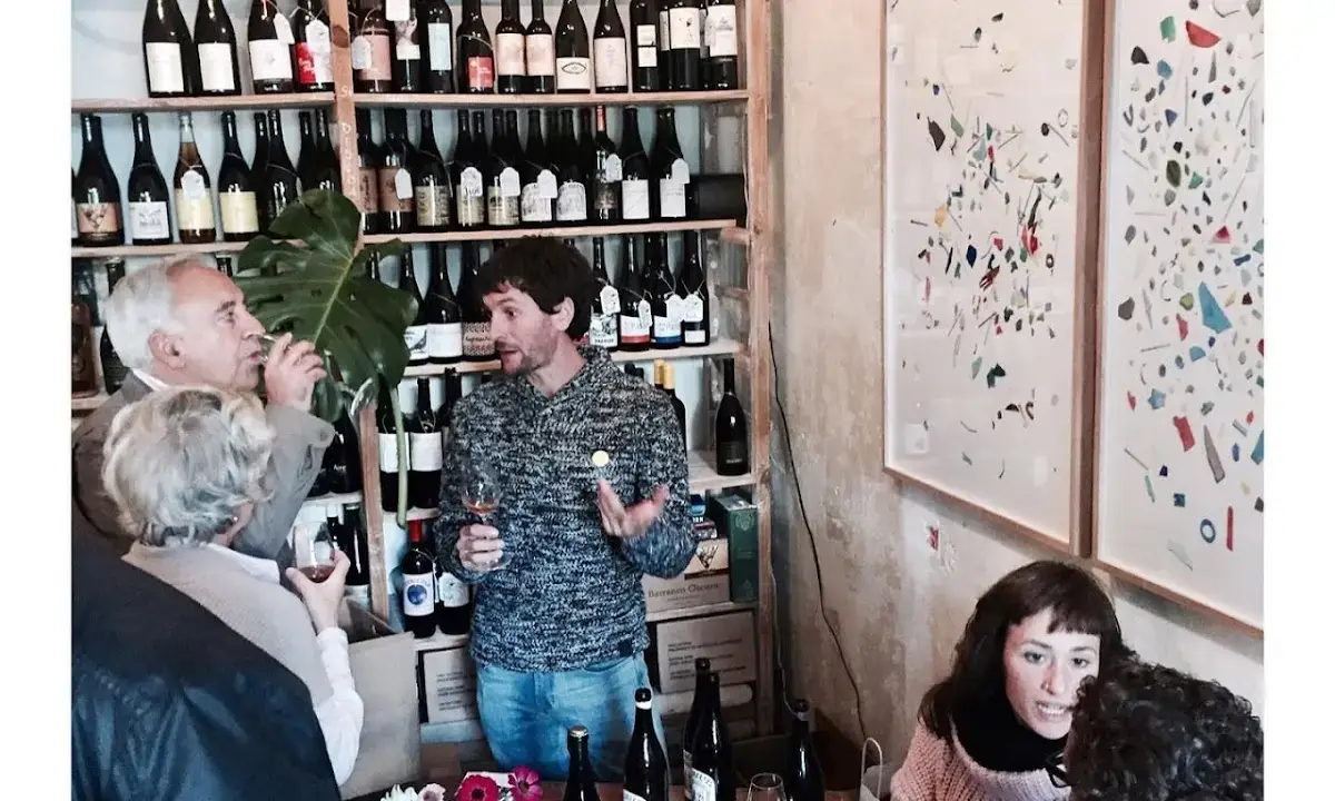 Counter at Jugo Vinos Vivos with bottles of natural wines and glasses