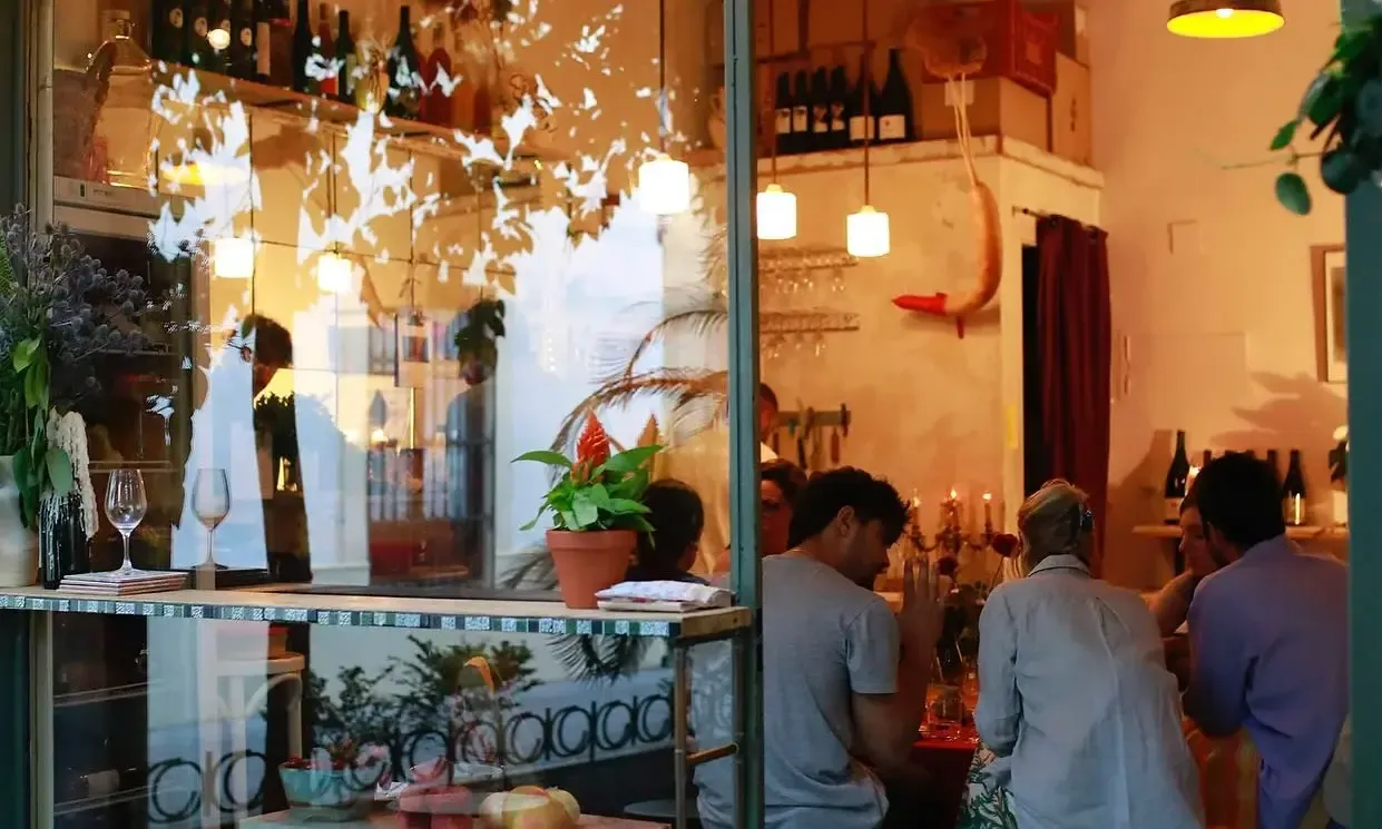Counter at Jugo Vinos Vivos with bottles of natural wines and glasses