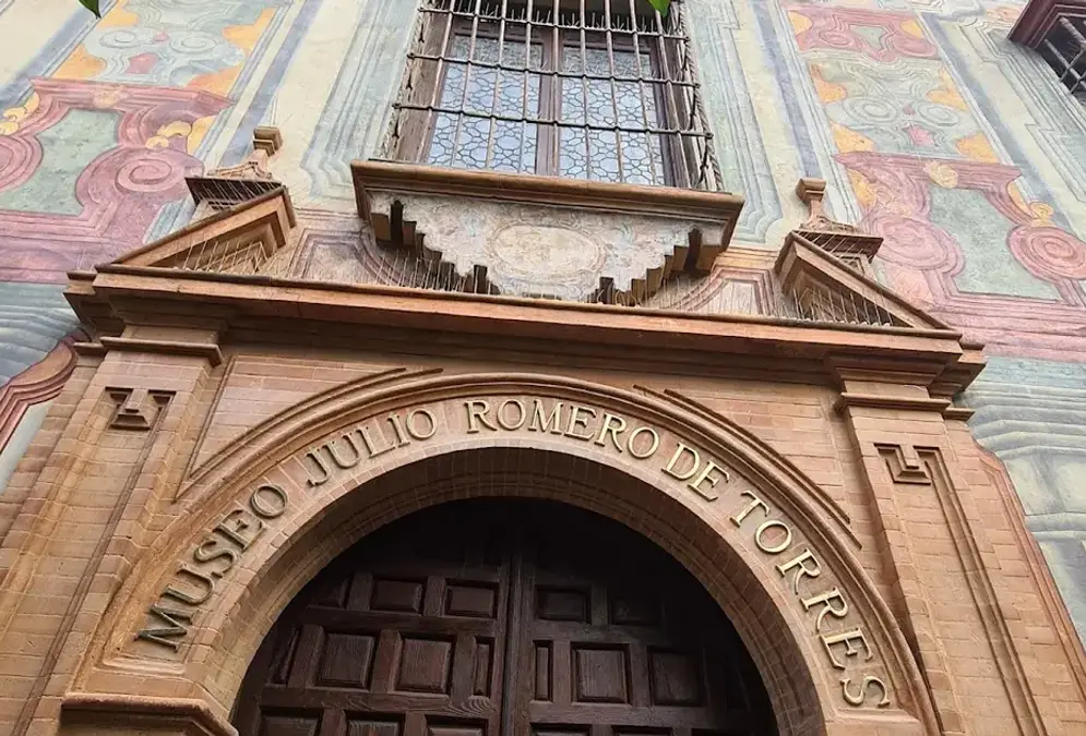 Gallery room at the Museo Julio Romero de Torres with portraits of Andalusian women
