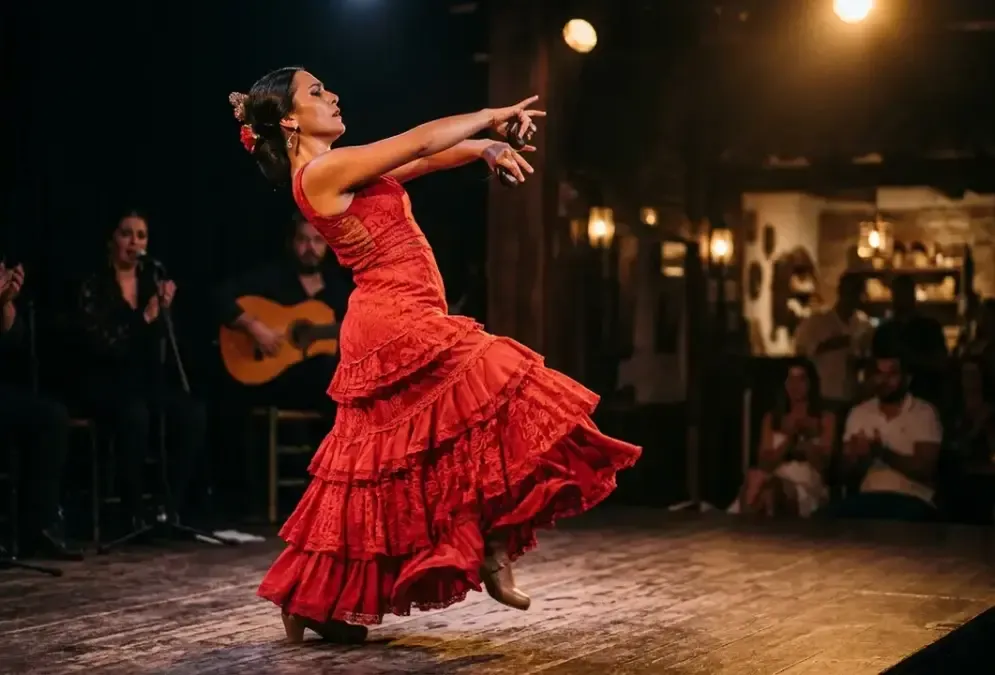 Flamenco dancer in red dress, dramatic stage lighting