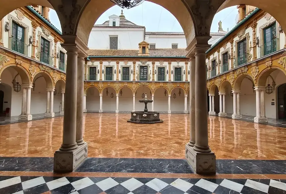Baroque facade of the Palacio de la Merced with bell tower and inner courtyard