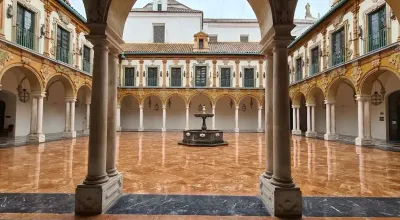 Baroque facade of the Palacio de la Merced with bell tower and inner courtyard