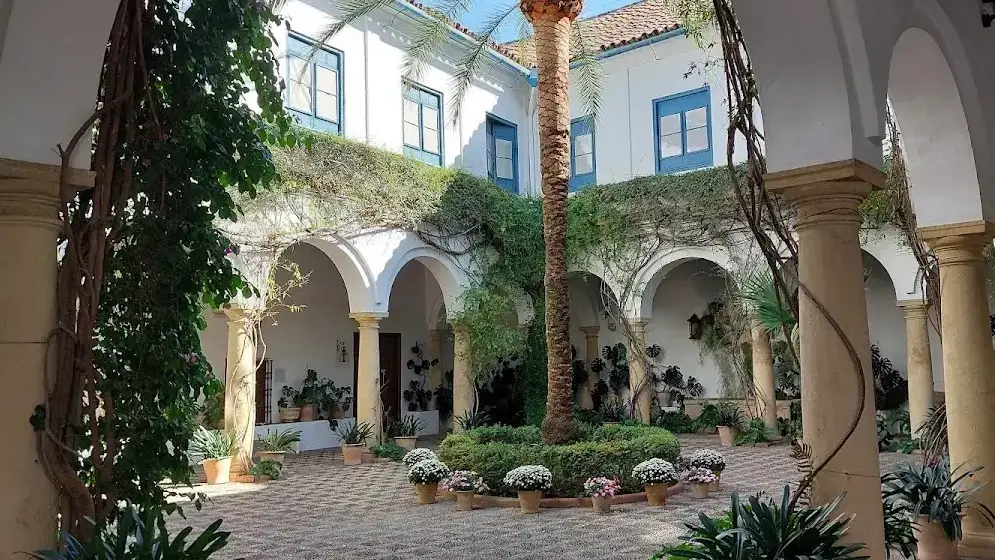 Courtyard of the Palacio de Viana with central marble fountain and orange trees
