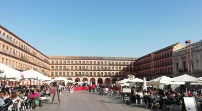 Plaza de la Corredera in Córdoba with its characteristic arcades and ochre facades
