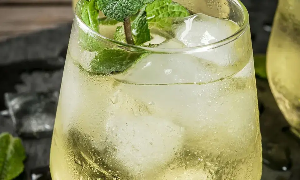 Glass of rebujito with ice and fresh mint, Andalusian fino cocktail