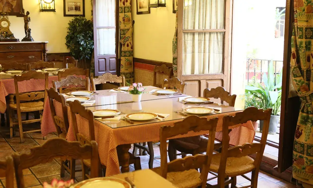 Authentic interior of Taberna San Miguel with traditional counter and local clientele