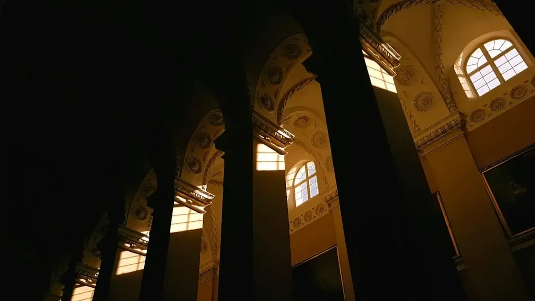 Interior of the Mezquita illuminated during The Soul of Córdoba night tour with artistic lighting
